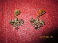 Bow and heart earrings for sale.