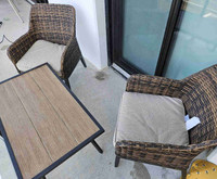 2 patio chairs and coffee table with cushions