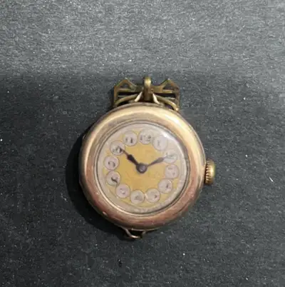 This is a vintage gold-tone pocket watch that would make a wonderful addition to any collection. Giv...