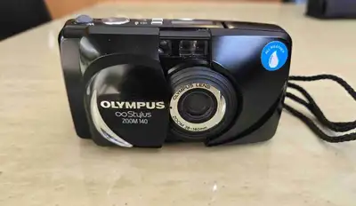 Old school 35 mm film camera. Includes camera, carrying case and strap. Needs a new 3v lithium batte...