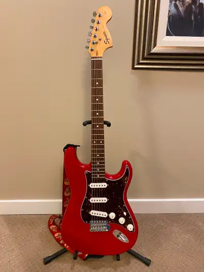 Squier Affinity Strat in Torino Red with custom tortoise shell pickguard. Strap and whammy bar inclu...