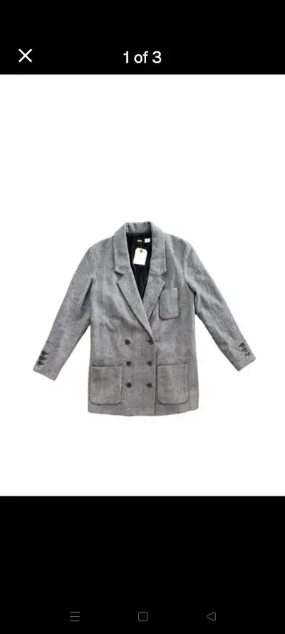 Elevate your wardrobe with this BDG Herringbone Wool Blend Coat. Crafted from a high-quality blend o...