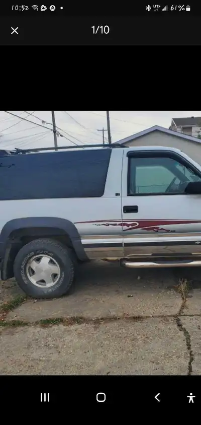 This 1996 Chevrolet Tahoe 2 Door is a four-wheel-drive SUV with a powerful engine and plenty of spac...