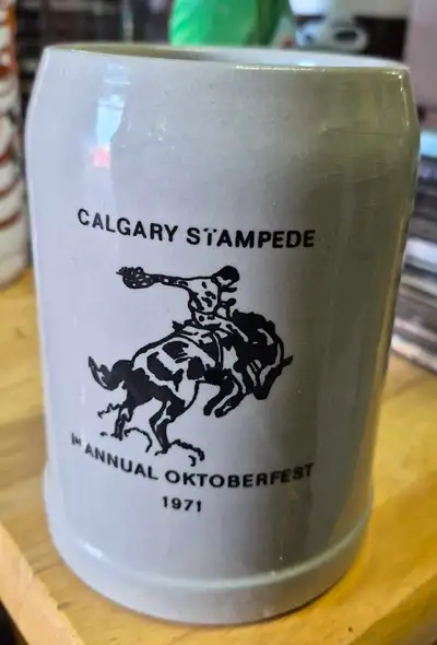 This vintage Calgary Stampede 1st Annual Oktoberfest 1971 stein is in used condition, perfect for co...