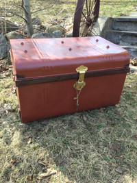 Large, antique metal storage trunk