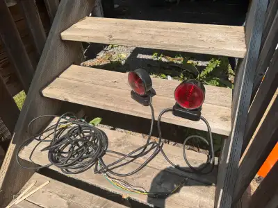 Trailer towing lights. They have a magnetic base. We used them once to haul a travel trailer with li...