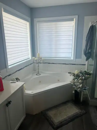 This large furnished master in a quiet home offers its own bathroom, mini fridge, microwave, hotplat...