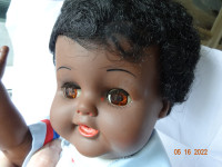 Black doll, 20inchs,by Reliable,Canada. hard plastic,brown eyes