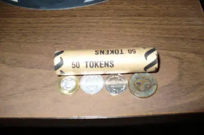 roll of 50 1954 ttc tokens $150 ttc token $3 ttc token 1954 $3 spokane transit token $4 massachusett...