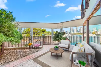 Serene Waterfront single level Townhouse offering breathtaking water, marina, city & mountain views!...