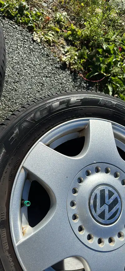 Four beetle mag wheels, 2 logo inserts, used Goodyear Eagle all-season tires. Wheels great condition...