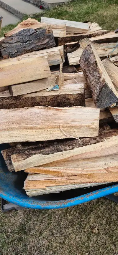 I'm offering a wheelbarrow full of seasoned jackpine split firewood, perfect for your fireplace or o...