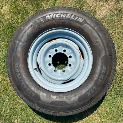 FOR SALE , ONLY 1 ! -USED- LT 245-75R16 TIRE ( MICHELIN ) LOAD RANGE: -E- , ON 16" AND 8-BOLTS WHEEL...