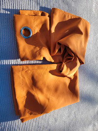 Orange blackout curtains with grommets each panel is 41x64