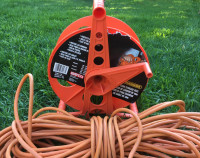 Bayco Cord Storage Reel (new) + 100' extension cord (used