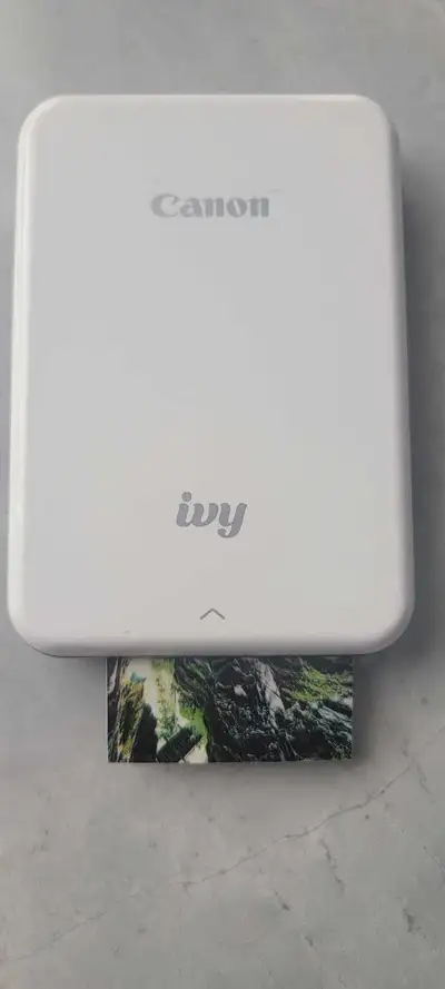 $100 OBO Selling my Canon IVY Zink portable photo printer. This little gadget prints wallet-sized ph...