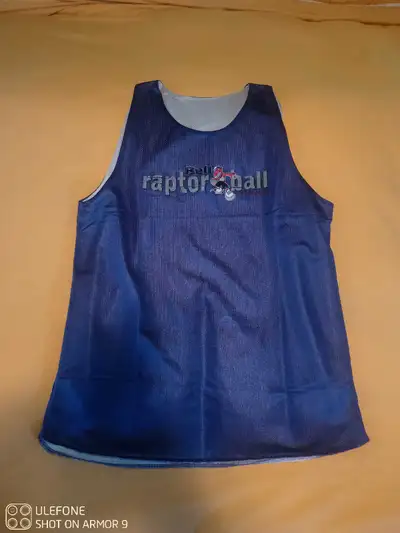 Vintage Toronto Raptors reversible Raptorball basketball jersey. Never worn. Size medium. Fresh out...