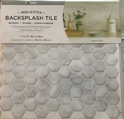 Peel and stick backsplash tiles. Each tile is 10 inches by 10 inches and there are 15 complete tiles...