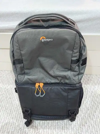 In like-new condition. Well-built and versatile backpack for cameras and lenses.