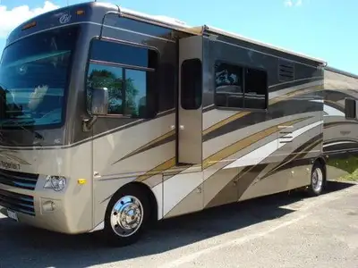 Beautiful RV with only 49,000Km on it. Central Vac, Stainless 2 door fridge, 4 burner stove, microwa...