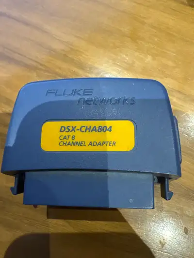 This is a used Fluke Networks DSX-CHA804 Cat 8 Channel Adapter, designed for high-performance networ...