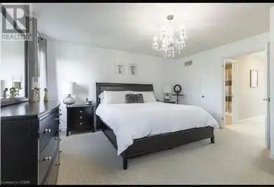 The master bedroom is available for rent immediately in a detached girls-only house near Sarnia Road...