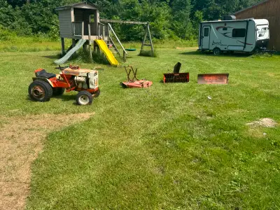 70’s Gilson lawn tractor with all the original attachments. Rear wheel weights, winter chains, lawn...