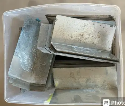 These are galvanized steel roof step flashings, perfect for ensuring a watertight seal around roof p...