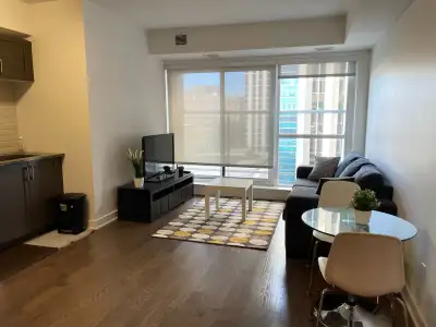 PRIME LOCATION! This furnished unit features an open-concept living space, a kitchen with stainless...