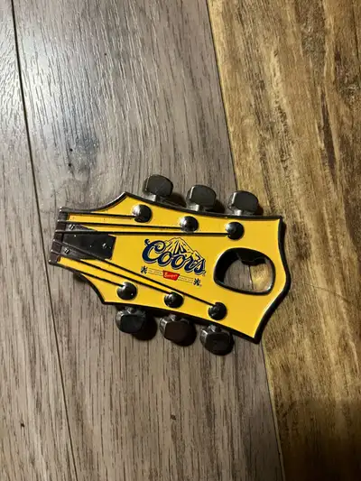 Coor's Banquet guitar head belt buckle and bottle opener, View more
