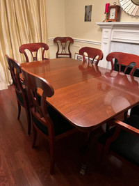 Mahogany dining table and eight chairs