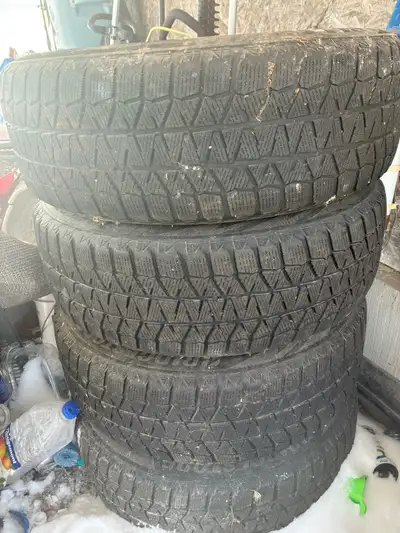 • Bridgestone Blizzak WS90 ( top-tier winters) • 225/65R17 • Steel rims included- slight surface rus...