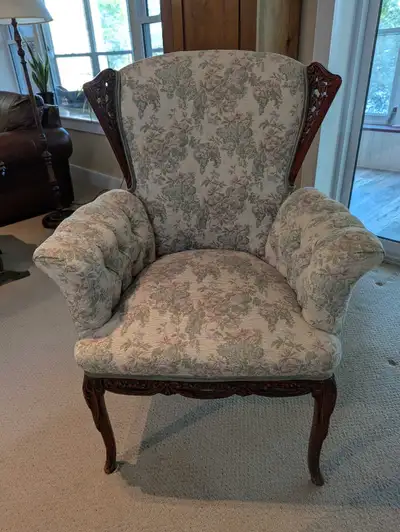 Two unique beautiful antique wing chairs. Intricate carved "wings" and detailing on seat and legs. L...