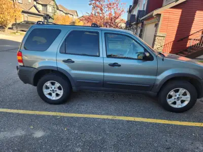 One family ford escape xlt fully loaded new tires all records of maintenance and repairs done great...