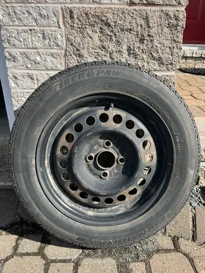 Uniroyal Tiger Paw Mud and Snow tires and rims off a 2013 Honda Fit. Average of 7-32 remaining on de...