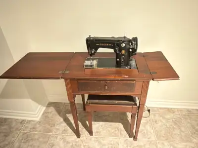 Antique Singer sewing machine and table.