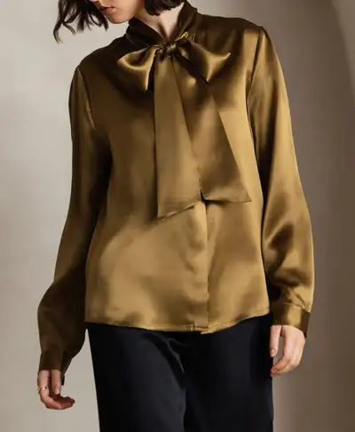This Silksilky blouse is made from 95% mulberry silk. It is brand new with tags and is an XL. This l...