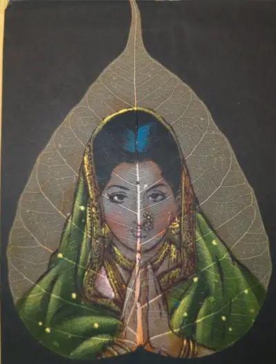 Unique artwork painted on a preserved Bodhi leaf. Depicts a woman in traditional attire, hands press...