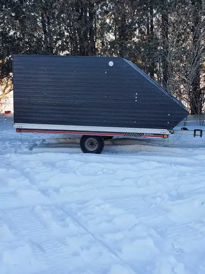 Triton Elite Snowmobile Trailer. Excellent condition. New axle, tires, rims and stainless lug nuts.