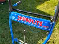 Snow flite 5 hp  24 inch