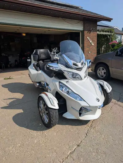 Pristine white Can-Am Spyder RT Limited three-wheel motorcycle. This vehicle has a BRP Rotax engine...