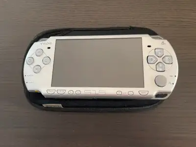 Mint condition Sony PSP 2000 that is modded. Comes with charger and protective sleeve.