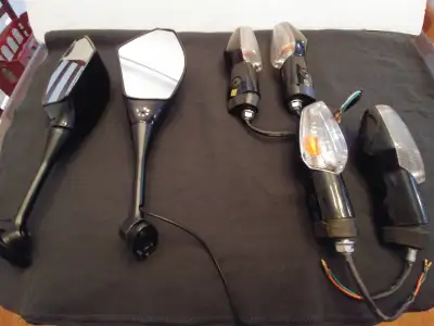 I have this set of aftermarket mirrors and signals that can be mounted on any motorcycle has an uppe...