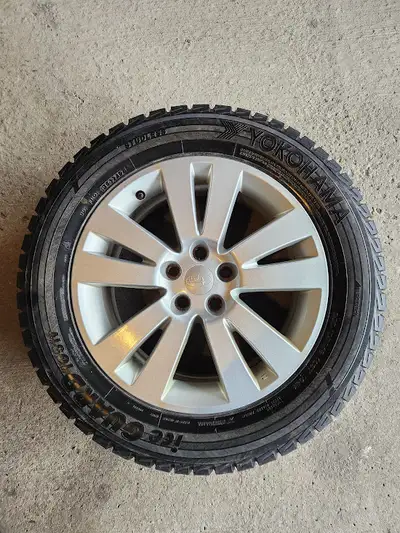• Four Yokohama ice guard winter tires on 18 inch Subaru genuine aluminum rims with Universal Tire P...