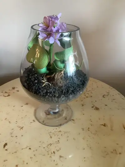 Decorative faux plant in glass vase, View more
