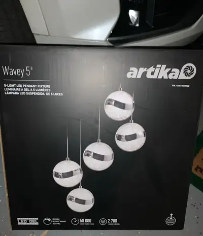 Illuminate your space with the modern elegance of the Artika Wavey 5 5-Light LED Pendant Fixture. Th...