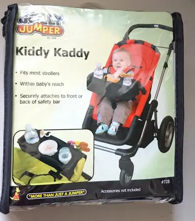 Brand New Jolly Jumper Kiddy Kaddy The Kiddy Kaddy allows your child to easily reach their snack or...
