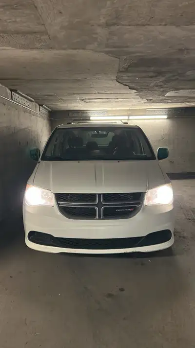 This Dodge Grand Caravan is a classic 7-passenger MPV, offering a flexible interior layout with fold...