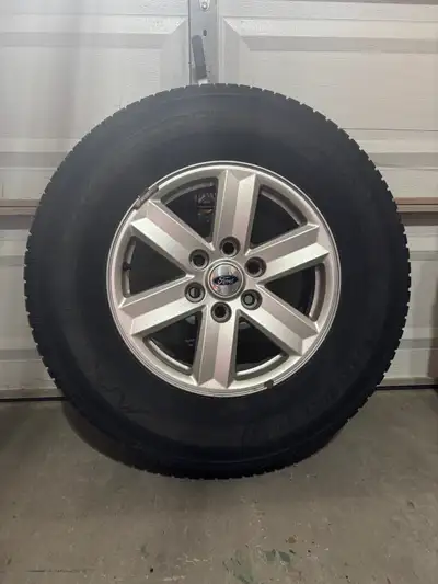 Selling a set of 4 Firestone Winterforce winter tires mounted on factory Ford alloy rims, size 265/7...