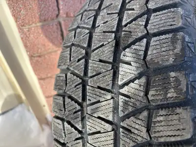 Bridgestone Blizzak winter tires on black steel rims with lots of life left. Tire size 215/65R16. Ri...